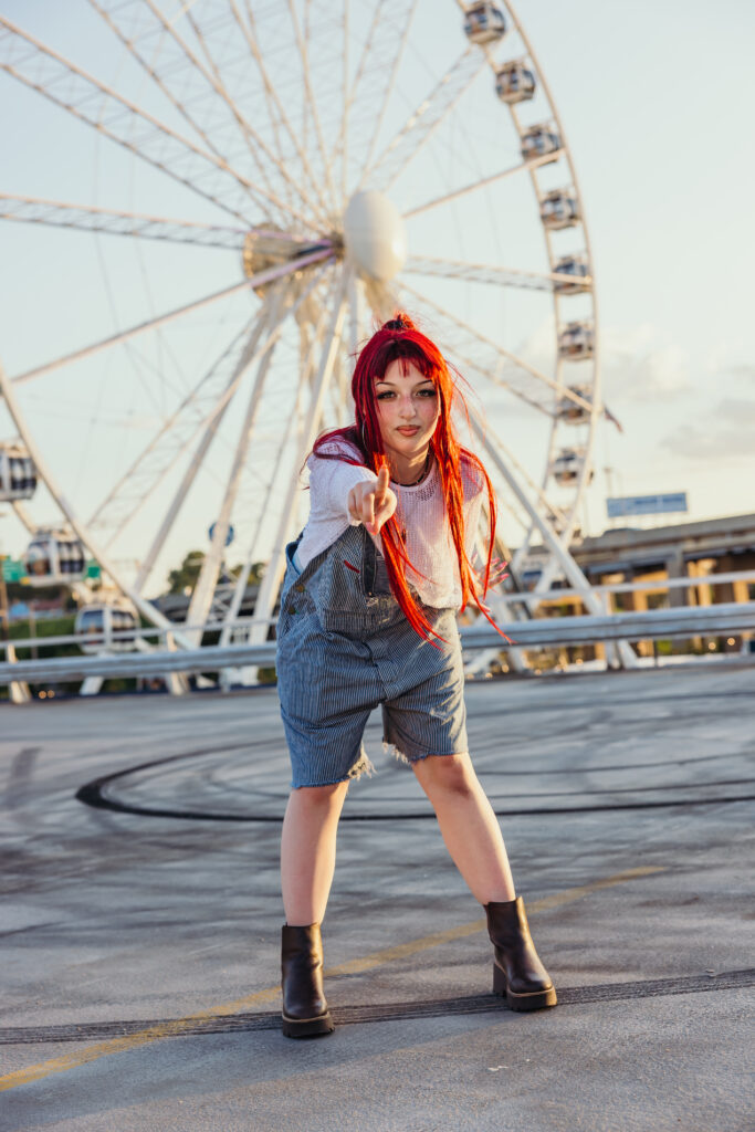 Senior photos in front of Kansas City ferris wheel in downtown KC