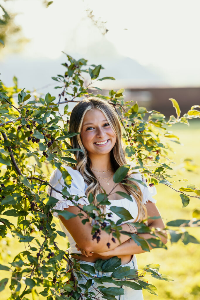 Kansas City high school senior smiling during outdoor portrait session