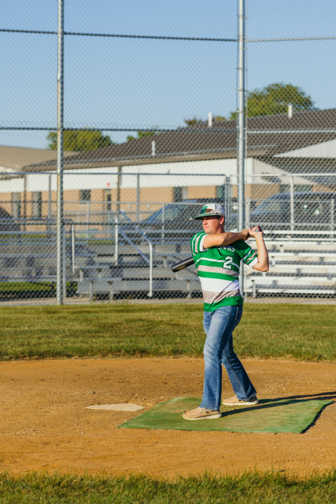 Senior baseball candid portraits of high school athlete on field in Kansas City