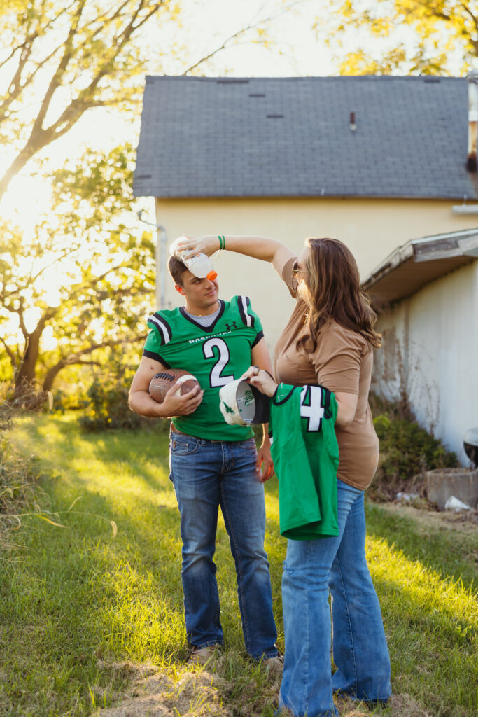 Candid moment between mother and son during high school senior portraits