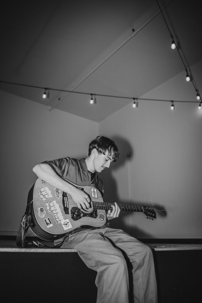 Musician senior portraits with guitar in Kansas City Missouri