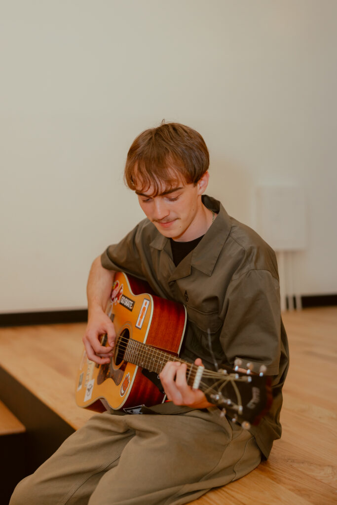 Kansas City senior portraits featuring guitar and natural light