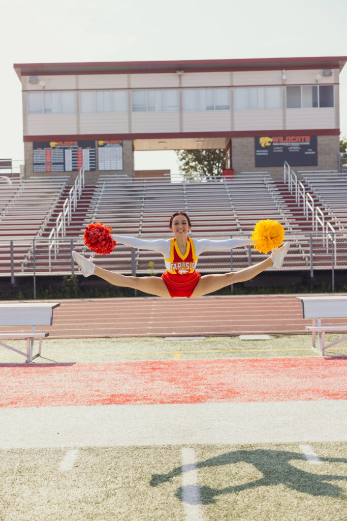 Senior cheerleader photos in Kansas City stadium stands and field location