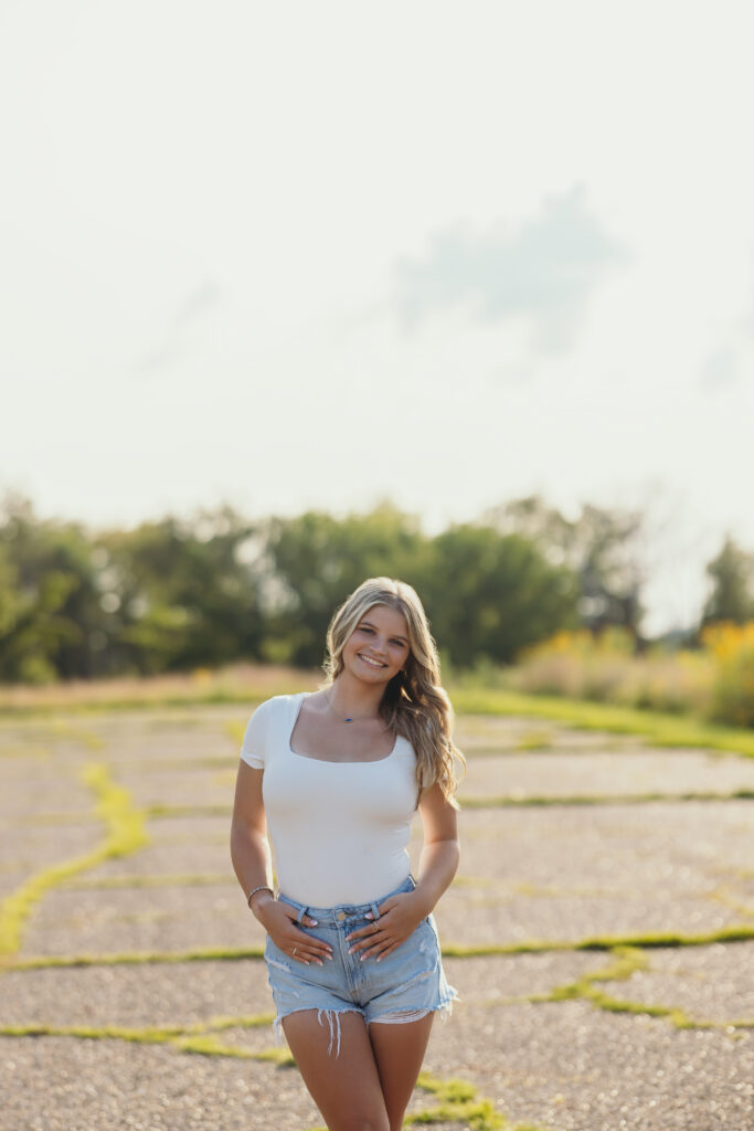 Summer photo session with Kansas City high school senior in a parking lot