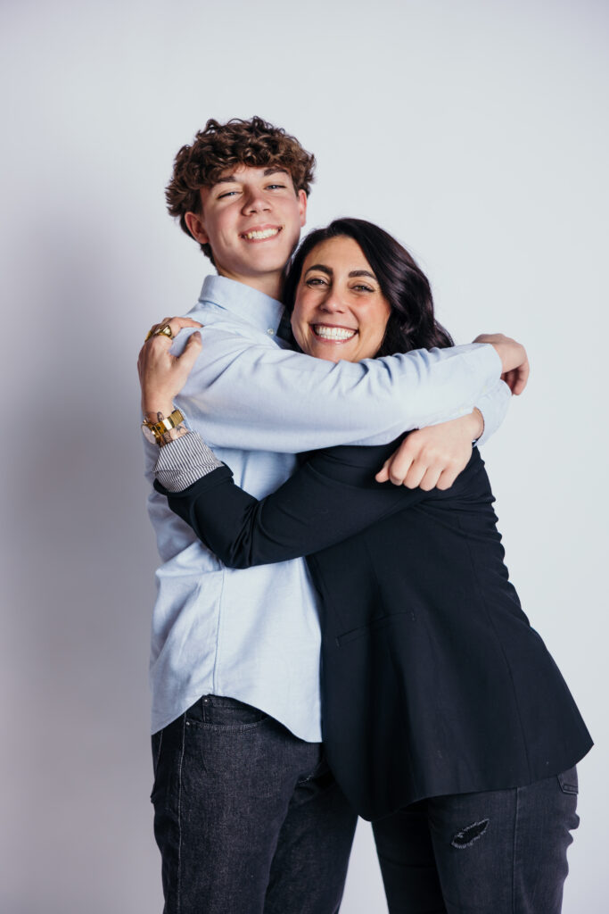 Mother and son posing together during Kansas City senior photo session