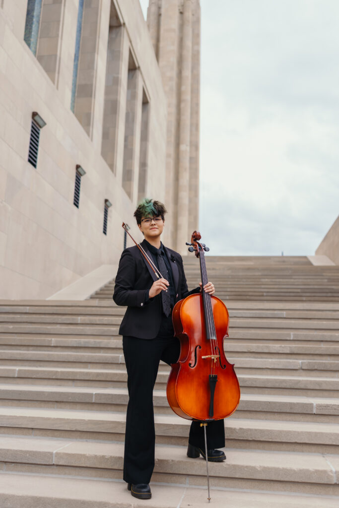 Creative senior portraits at Liberty Memorial featuring Kansas City student musician