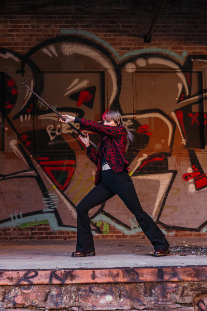 High school senior performing taekwondo pose during senior photo session