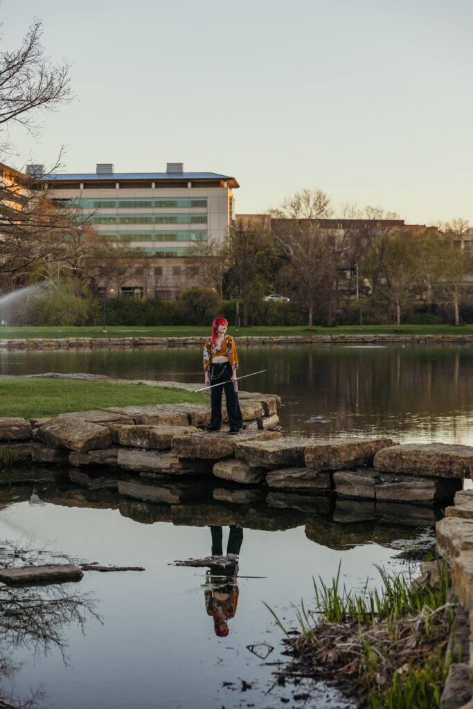 Kansas City senior with bo staff in nature setting
