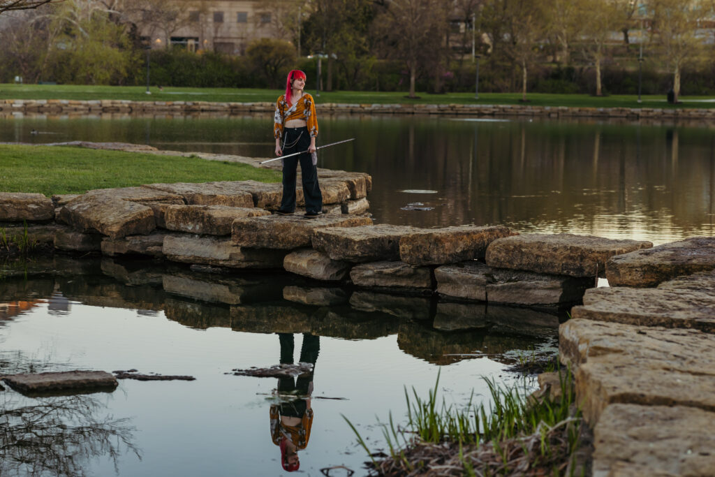 Kansas City senior with water reflection at Kauffman Legacy Park