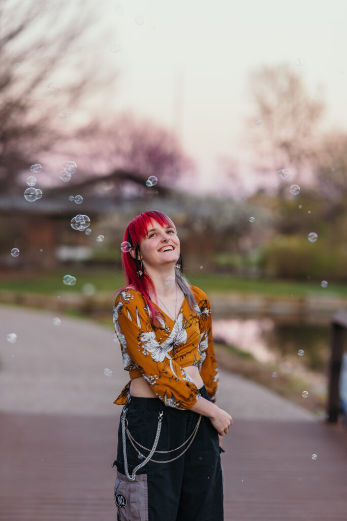 High school senior laughing during portrait session in Kansas City