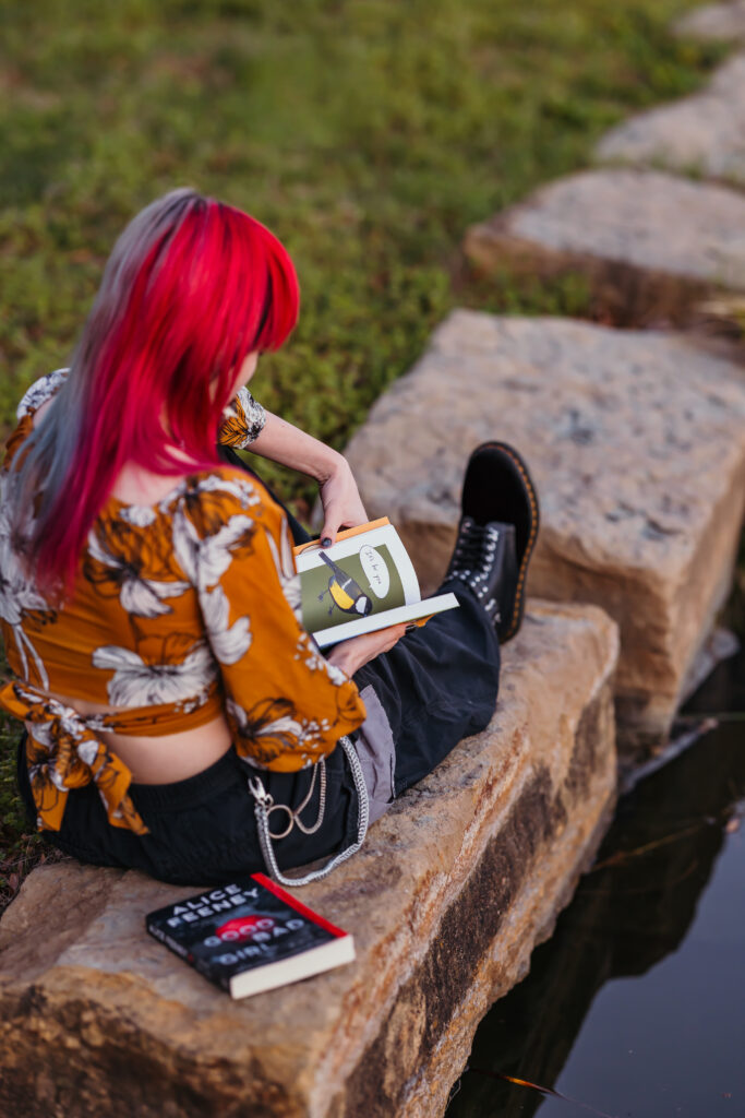 Kansas City senior posed with book during senior session