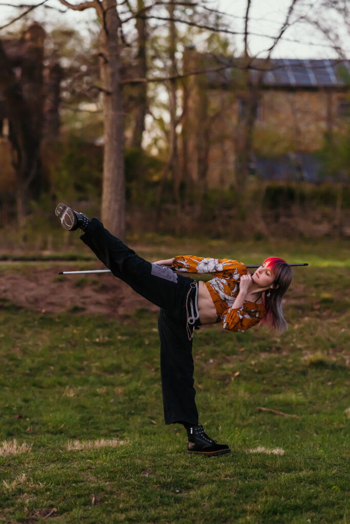 Taekwondo senior portraits in Kansas City park with greenery
