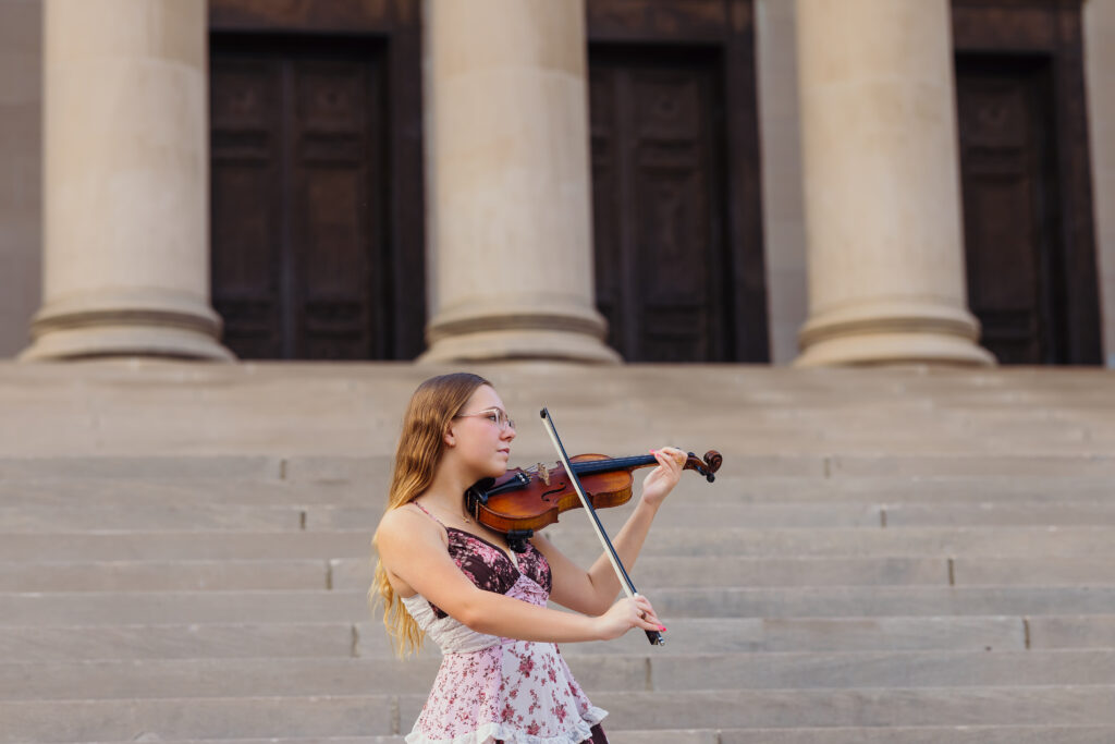Elegant senior portraits at the Nelson-Atkins Museum featuring senior girl with violin