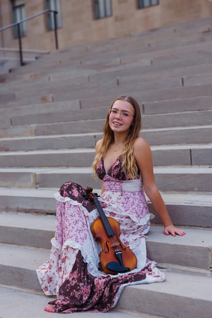 Kansas City senior session at the Nelson with violin and classic architecture backdrop