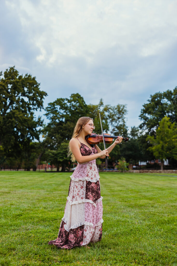Sophisticated Kansas City senior photos at the Nelson featuring violin and timeless style