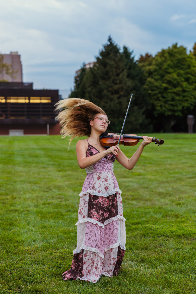 Creative senior portraits of senior girl musician with violin at Nelson-Atkins Museum