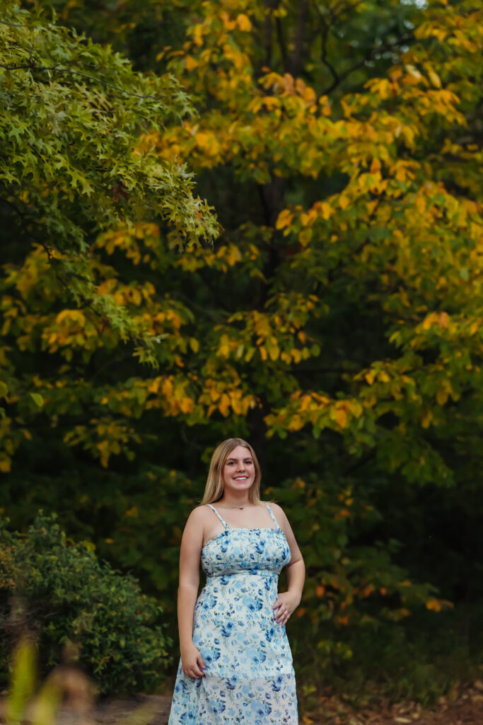 Fall senior portraits in Kansas City with colorful autumn leaves