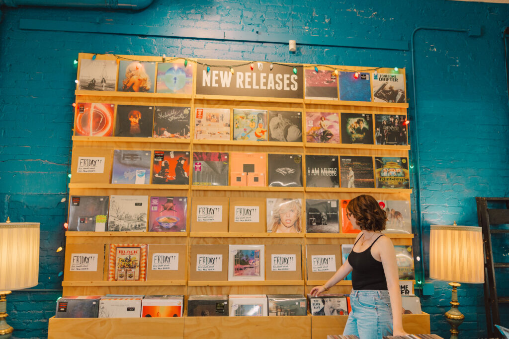 Kansas City high school senior girl inside Mills Record Company during senior photo session