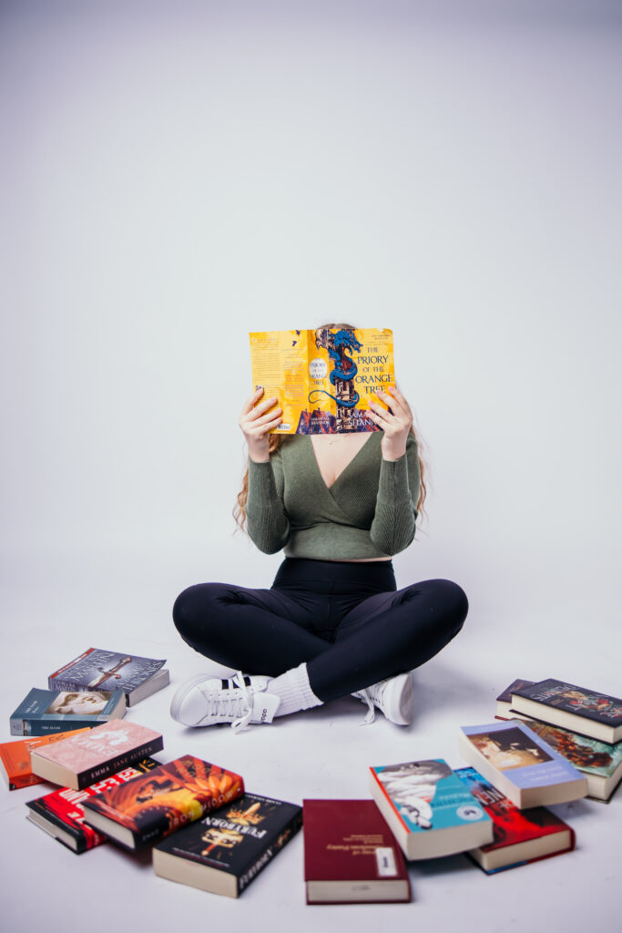 Creative senior session with book lover high school senior girl