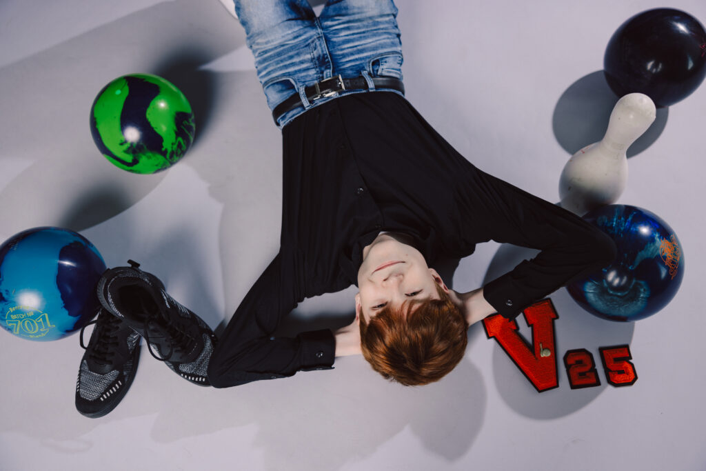Senior athlete studio photos of Kansas City boy with bowling gear