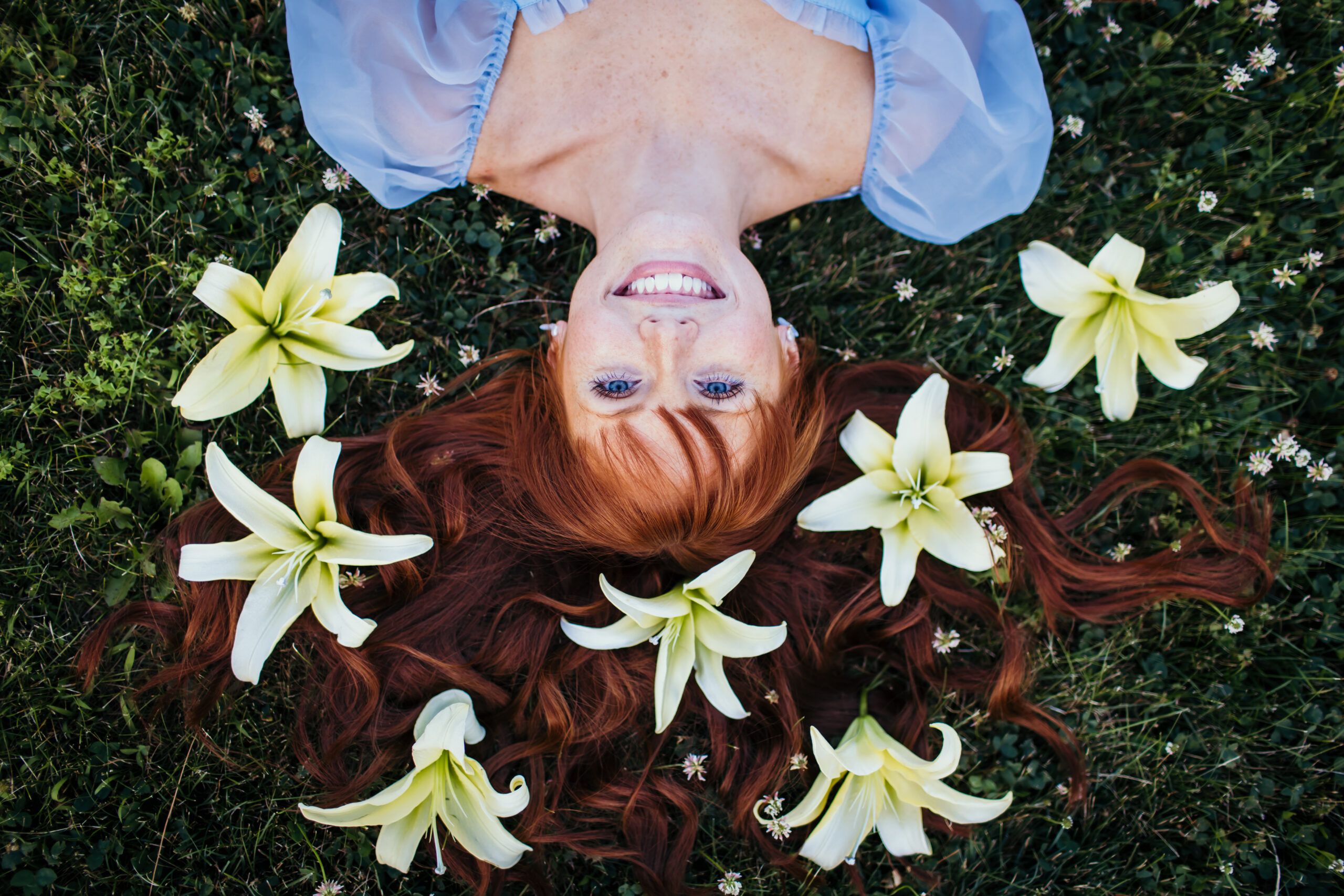 High school senior girl with flowers in her hair