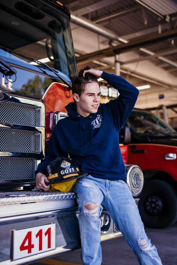 Kansas City senior photos of senior boy at local fire station