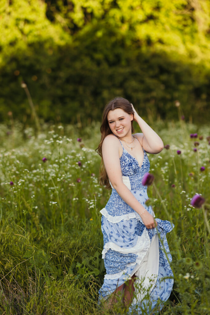 Senior session in a field with wildflowers
