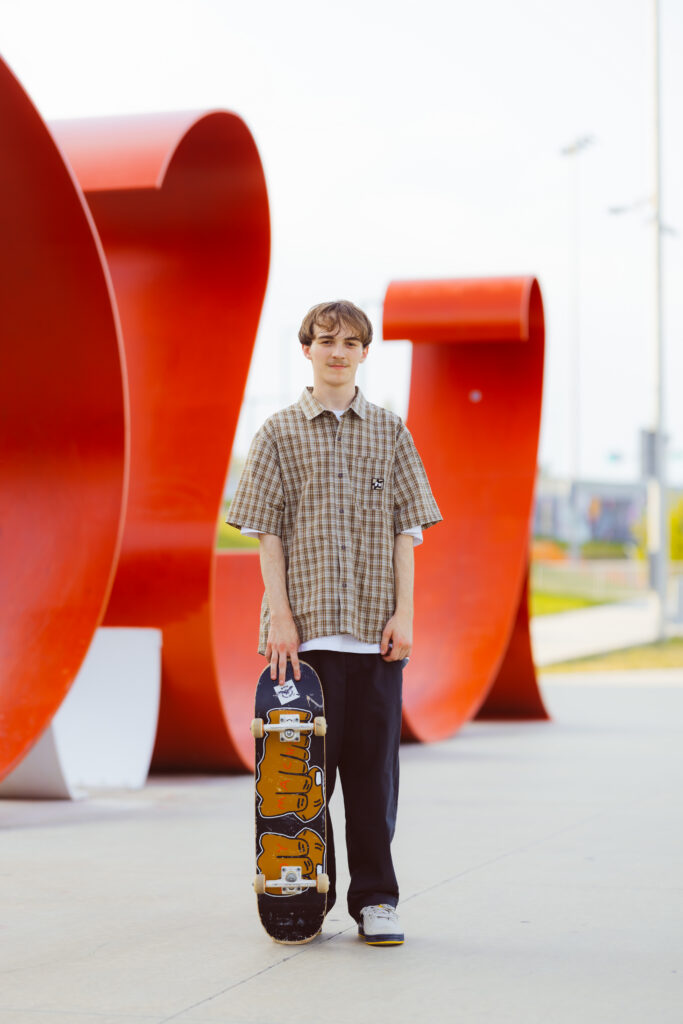 High school senior boy photo session with skateboard