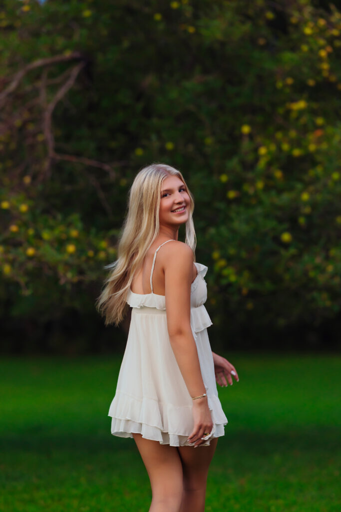 High school senior girl walking away during senior session