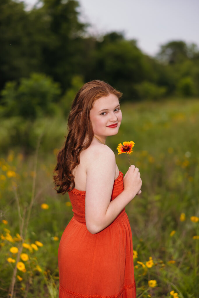 High school senior in a wildflower field