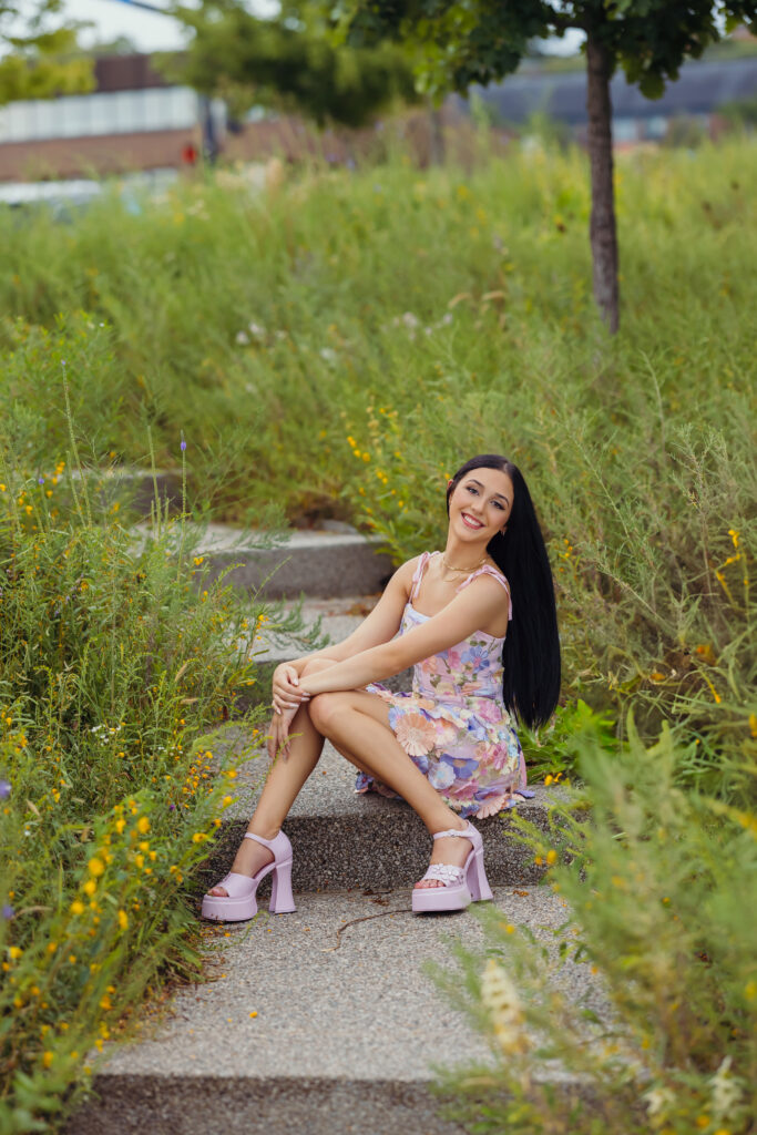 High school senior girl with floral dress and fun shoes