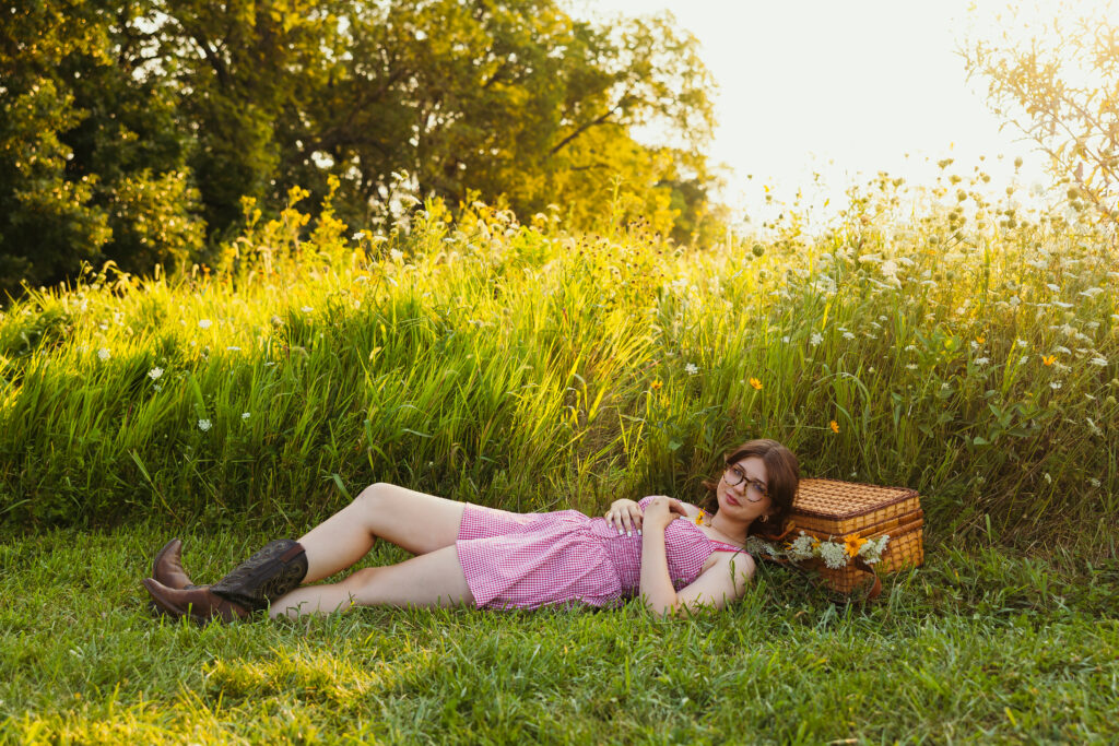 Kansas City high school senior girl at Shawnee Mission Park with vintage whicker basket and wildflowers