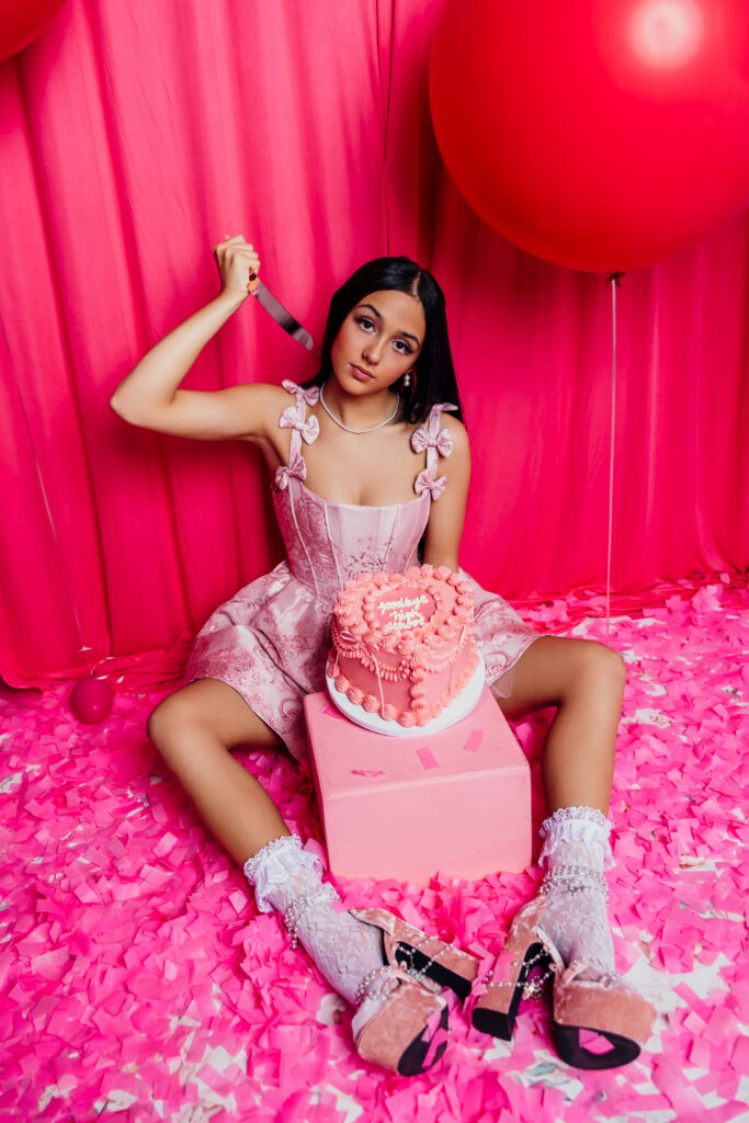 High school senior girl studio session with goodbye high school cake