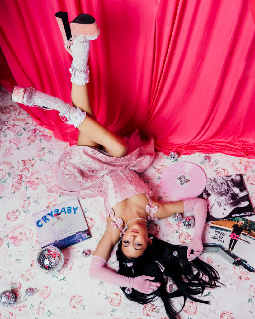 High school senior studio session featuring pink, disco balls, and records