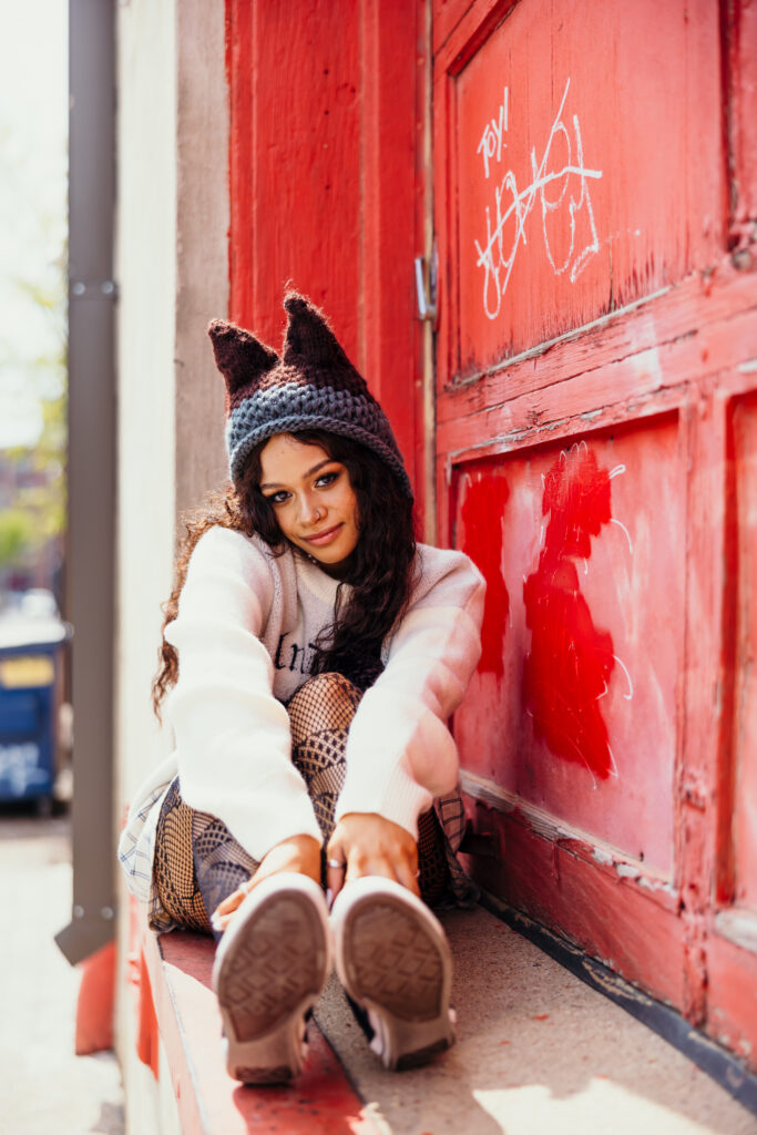 High school senior in urban setting with unique style