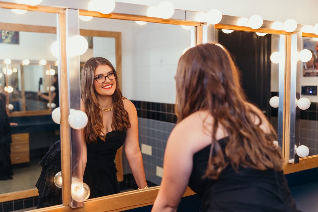 Kansas City senior photos celebrating her love of music and theater with dressing room photos
