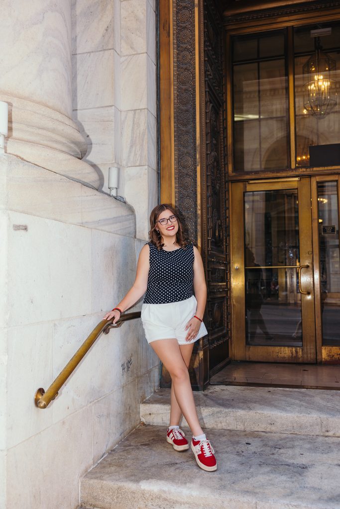 Downtown Kansas City senior portraits inspired by senior's love of books and reading
