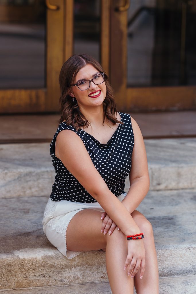 Downtown Kansas City senior portraits inspired by senior's love of books and reading