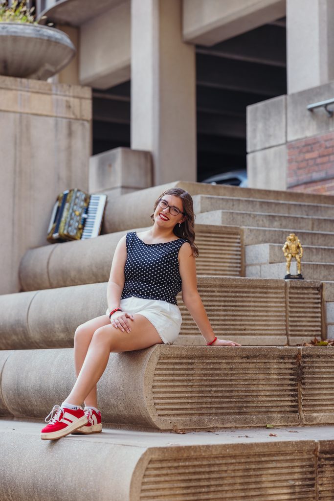 Downtown Kansas City senior portraits inspired by senior's love of books and reading
