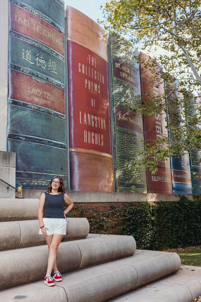 Downtown Kansas City senior portraits inspired by senior's love of books and reading