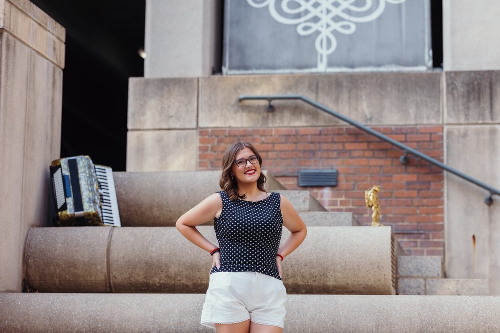 Downtown Kansas City senior portraits inspired by senior's love of books and reading