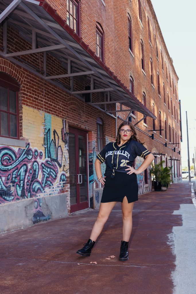 Edgy West Bottoms senior portraits in front of colorful graffiti