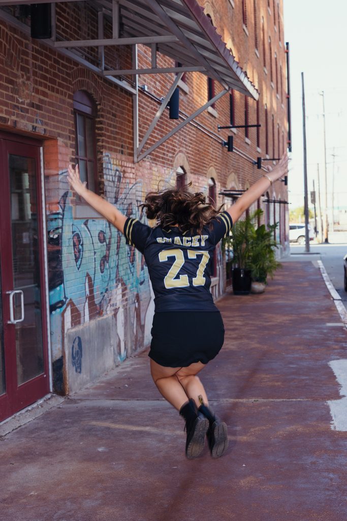Edgy West Bottoms senior portraits in front of colorful graffiti