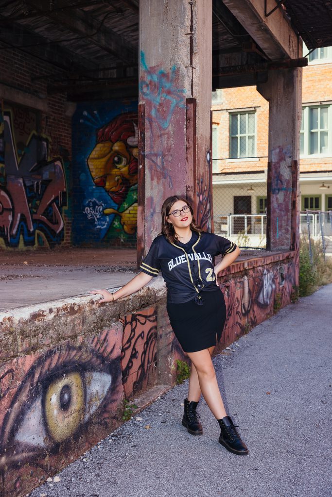 Edgy West Bottoms senior portraits in front of colorful graffiti
