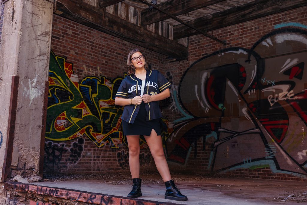 Edgy West Bottoms senior portraits in front of colorful graffiti