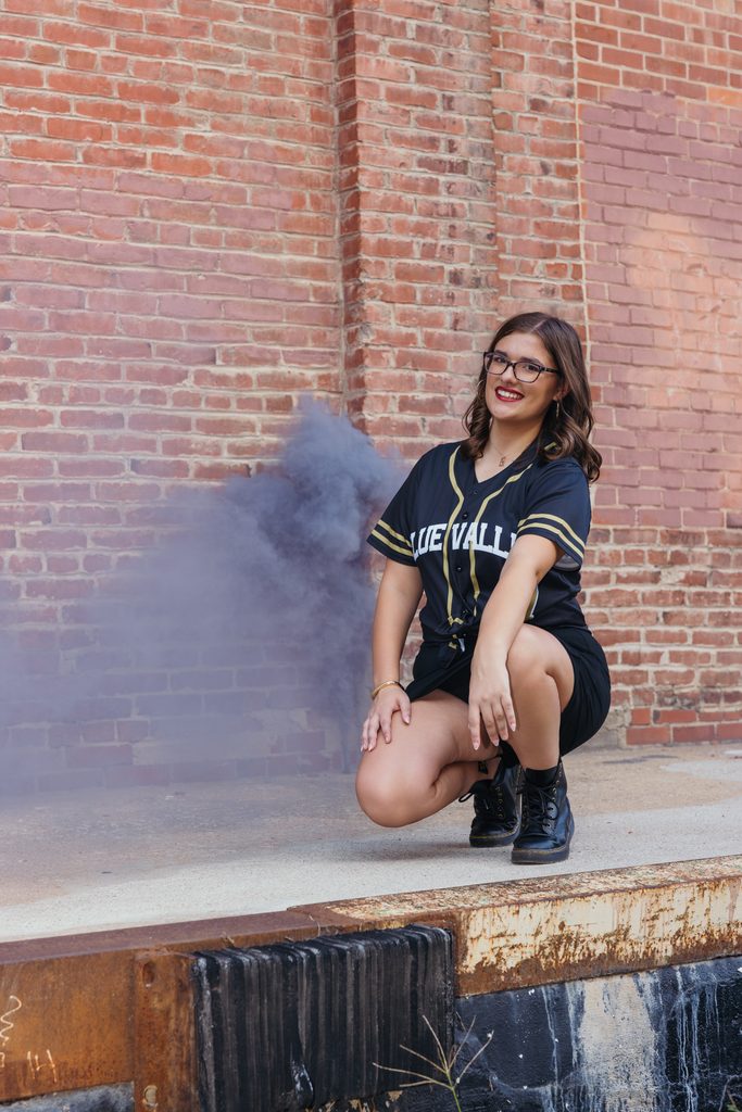 Edgy West Bottoms senior portraits in front of urban brick building