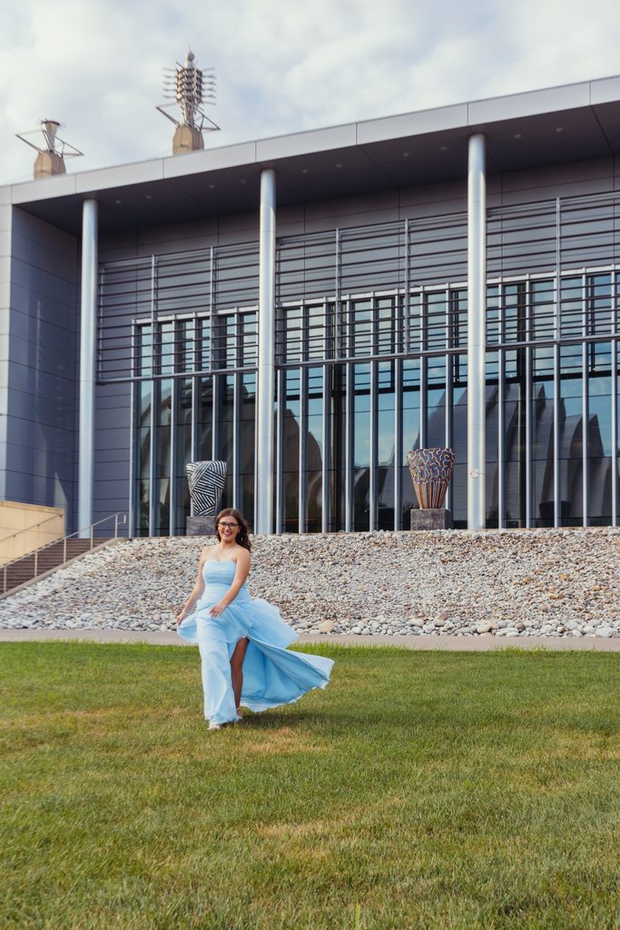 Kansas City senior portraits in a blue dress at the Kauffman Center for the Performing Arts