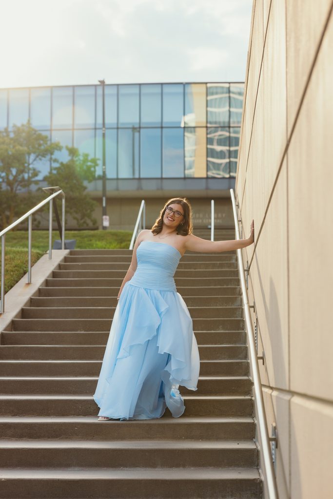 Kansas City senior portraits in a blue dress at the Kauffman Center for the Performing Arts