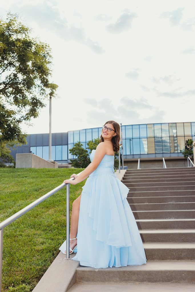 Kansas City senior portraits in a blue dress at the Kauffman Center for the Performing Arts