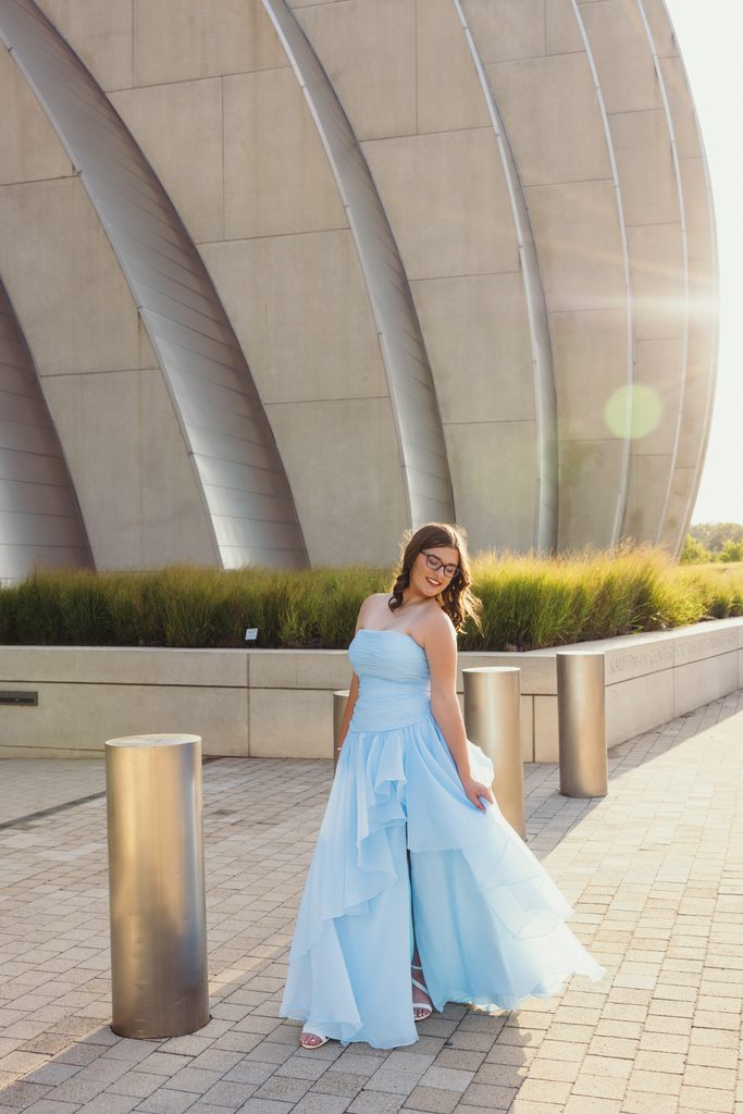 Kansas City senior portraits in a blue dress at the Kauffman Center for the Performing Arts